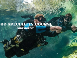 Two divers practicing sidemount diving technique during specialty course underwater