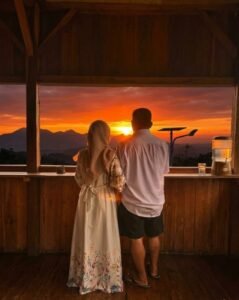 Couple enjoying a romantic trip to Flores Island with stunning sunset views and beautiful tropical landscapes in Indonesia.