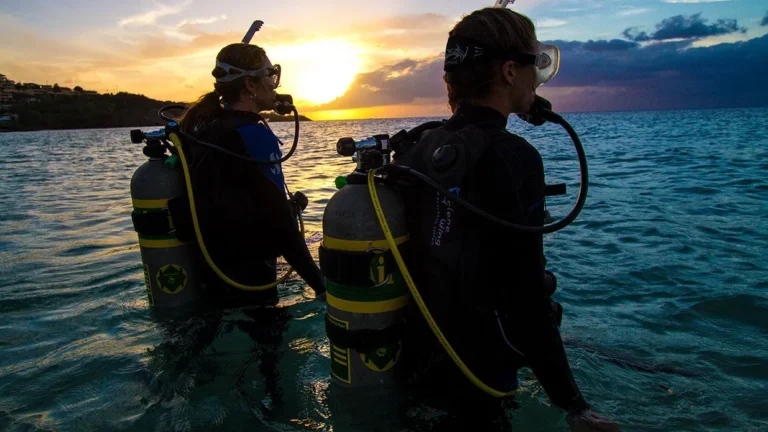 Honeymoon Diving Experience Labuan Bajo aboard a luxury phinisi boat with romantic sunset, crystal clear water, Komodo Island diving, and tropical island adventure.