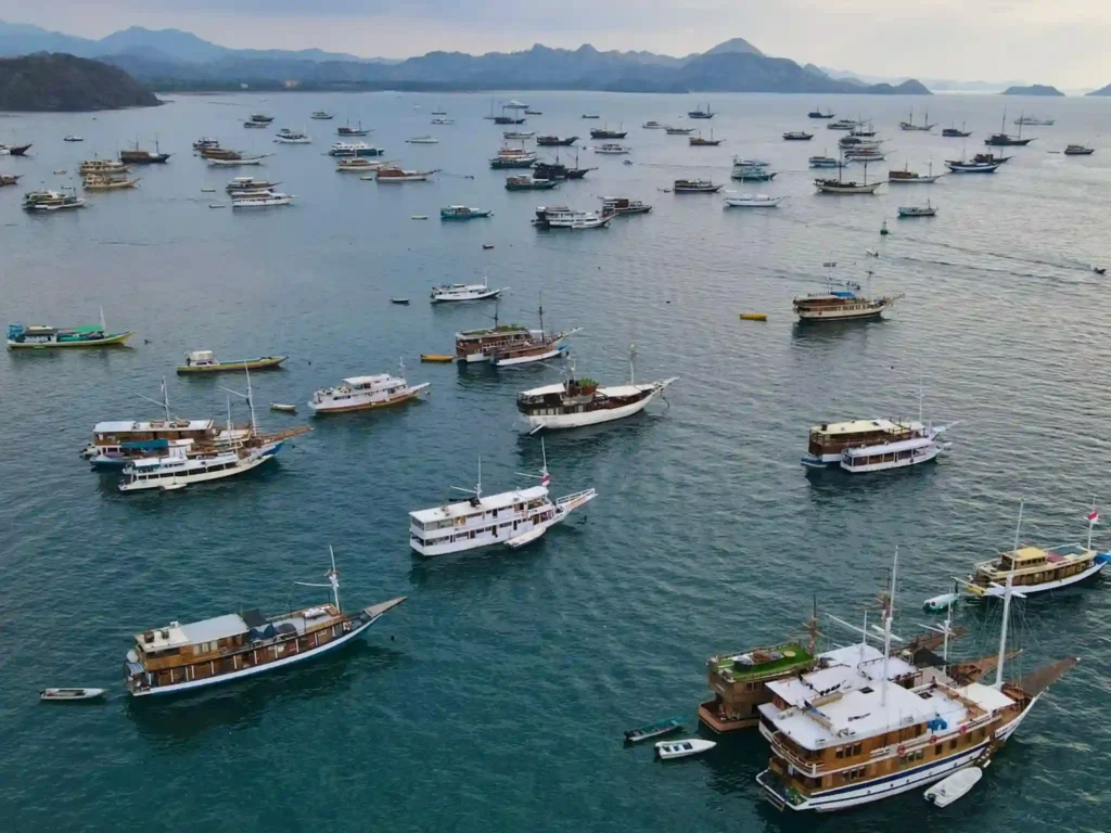 Luxury phinisi boats anchored in Labuan Bajo harbor - Visit Labuan Bajo Komodo
