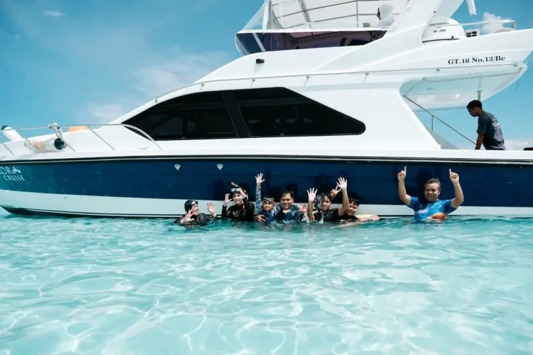 Private speed boat trip in Labuan Bajo with guests enjoying crystal clear water during a Komodo Island one day tour by Visit Labuan Bajo Komodo.